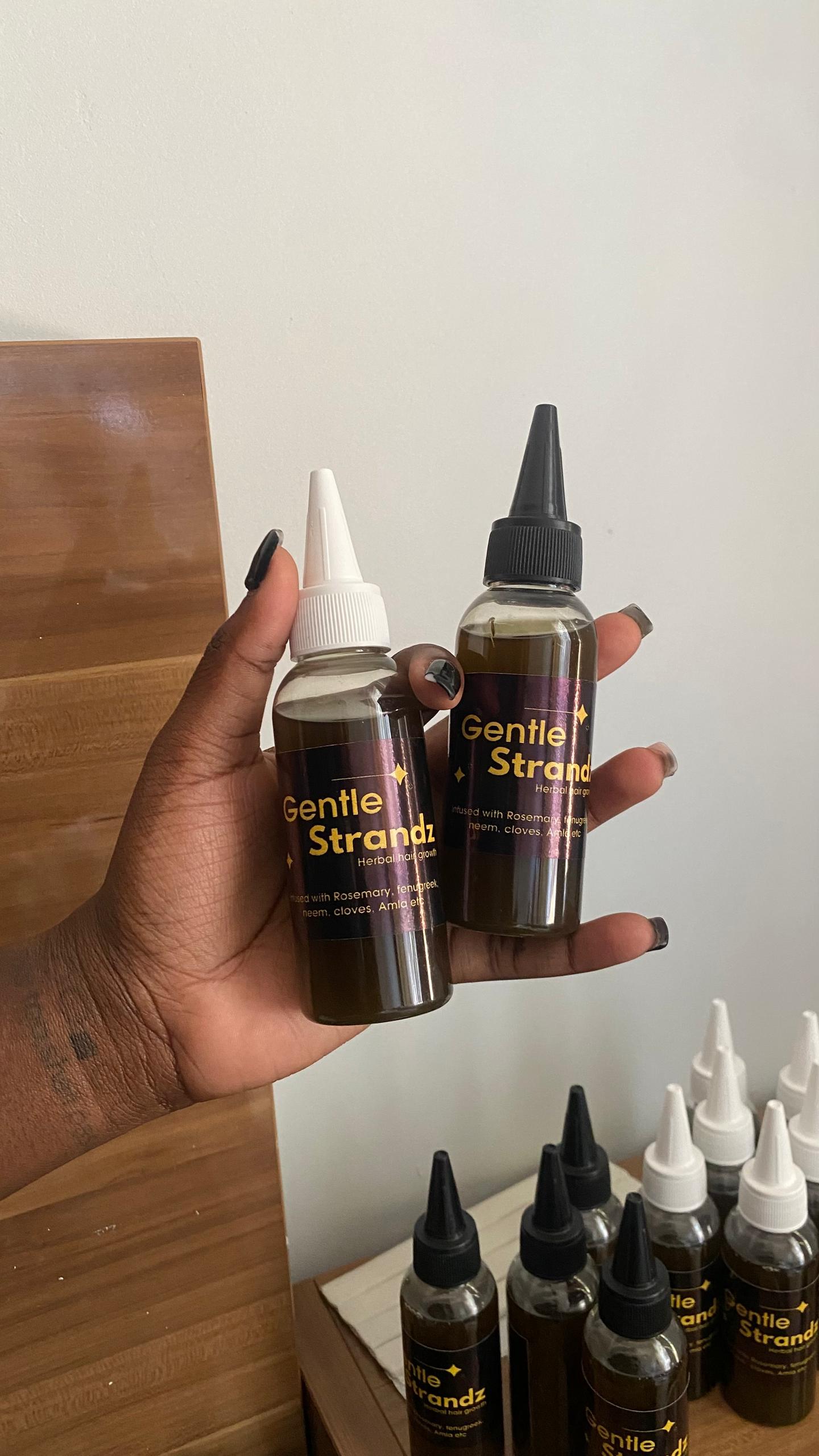 Original real-life photograph of two Gentle Strandz oil bottles